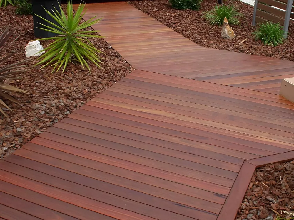 Mahogany decking boards complementing a modern garden design