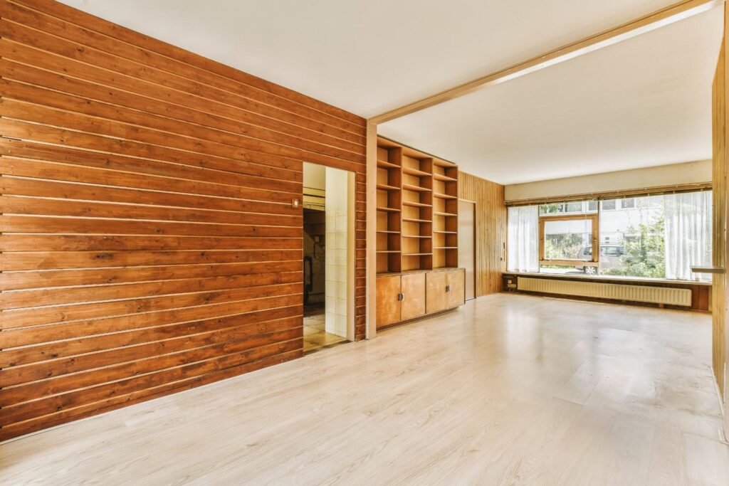empty-interior-with-wooden-wall-and-bookshelves-2026-03-18-12-06-49-utc (1)
